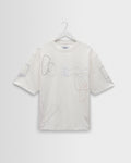 Milton - T-shirt en coton biologique écru à formes brodées